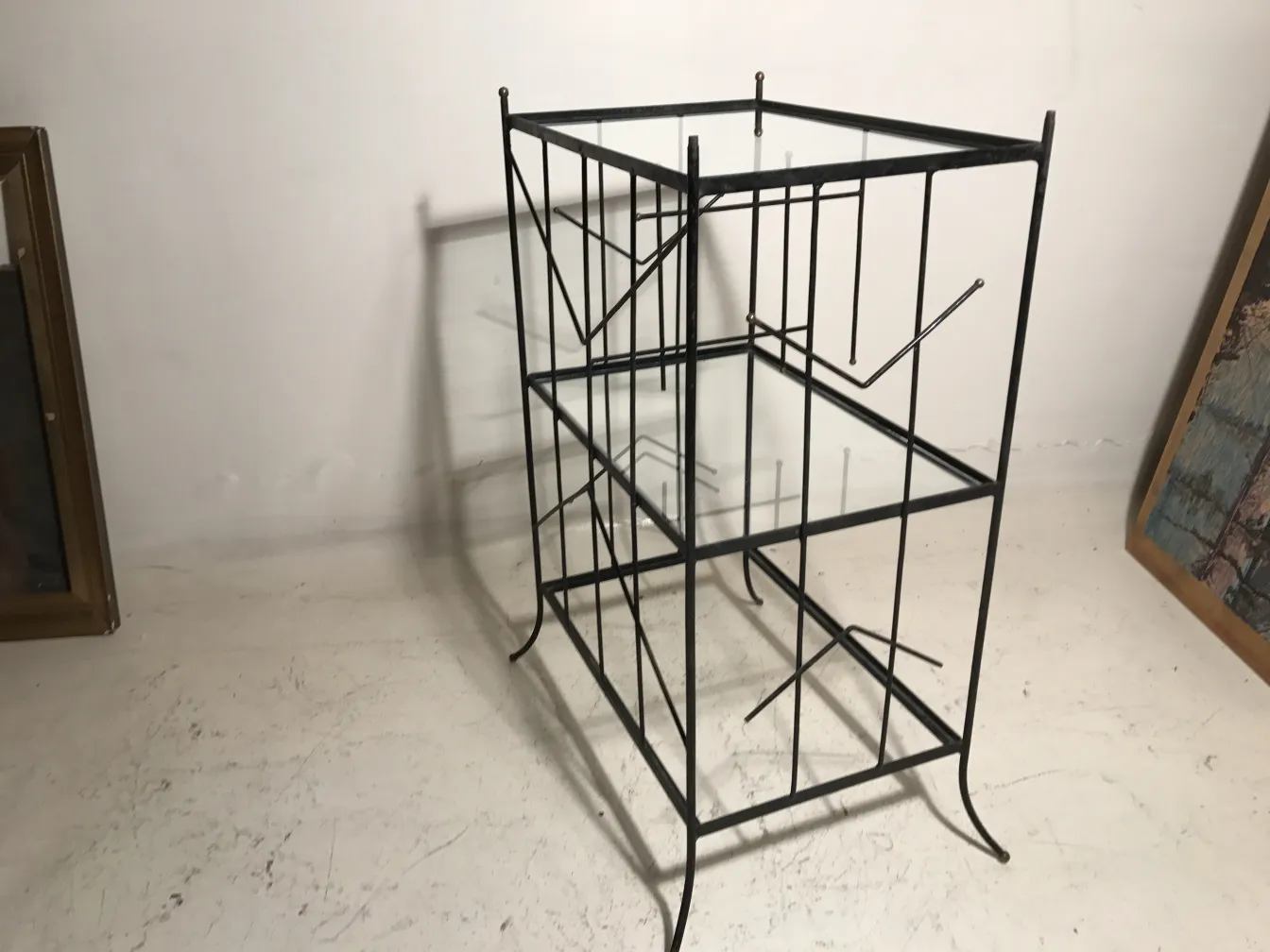 Antique bookcase with metal structure in a simple environment