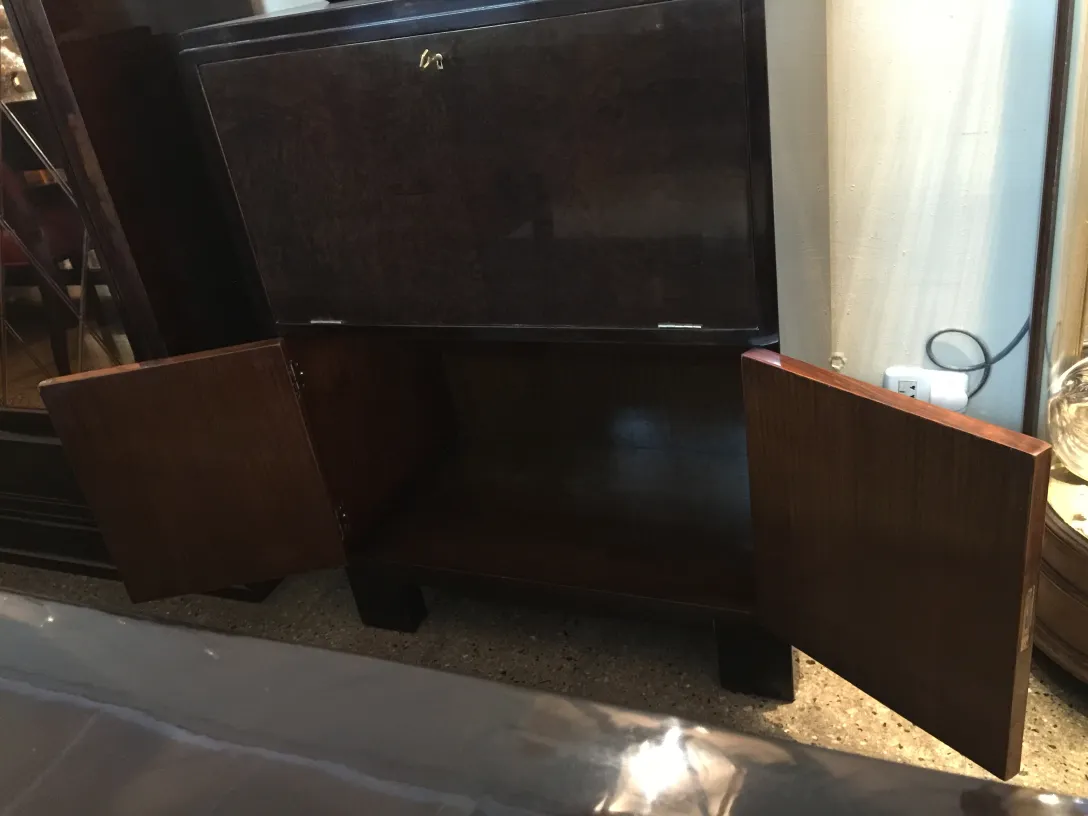 Antique bar cabinet with open doors and elegant design