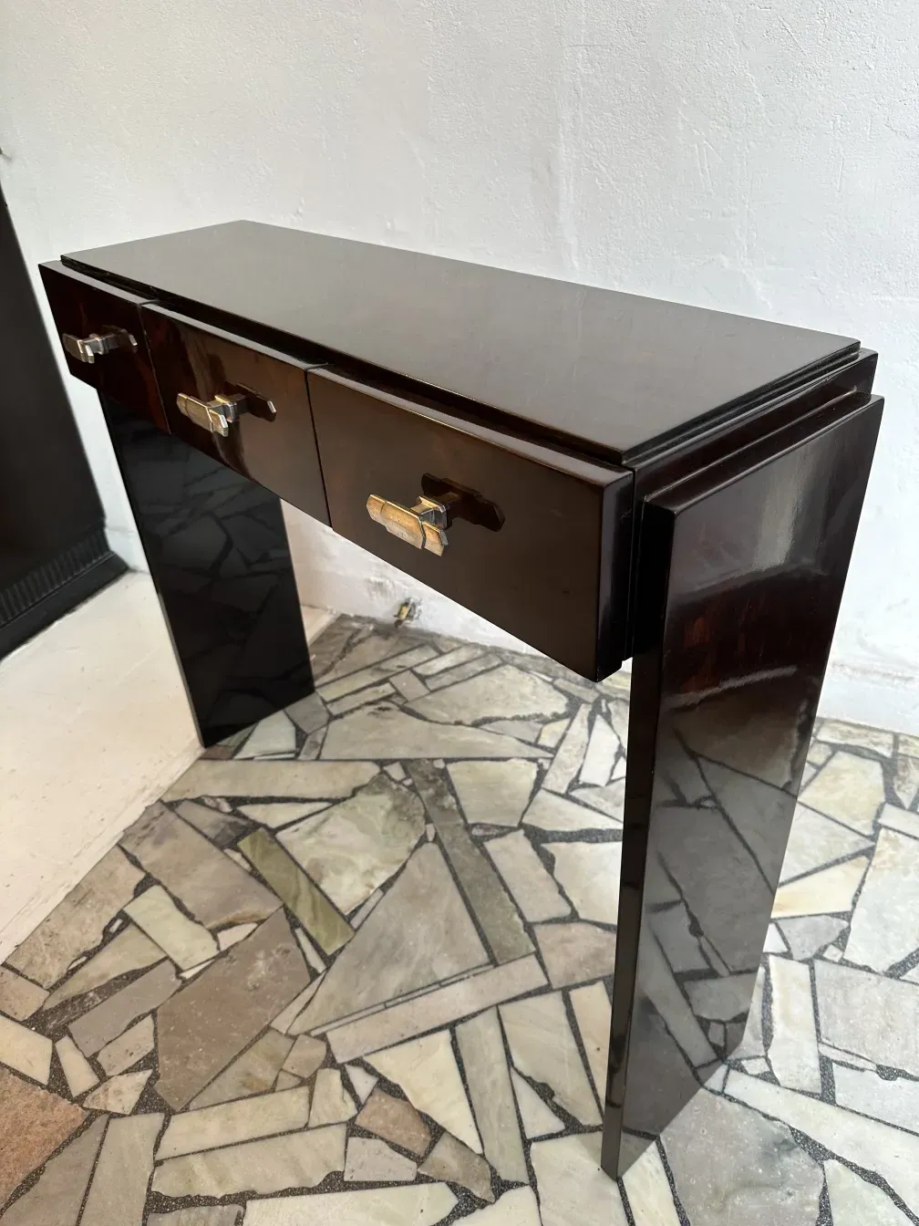 two antique consoles featuring elegant design with drawers