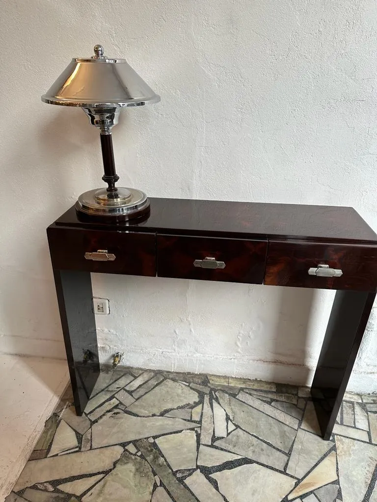 two antique consoles in a neutral setting, with drawers