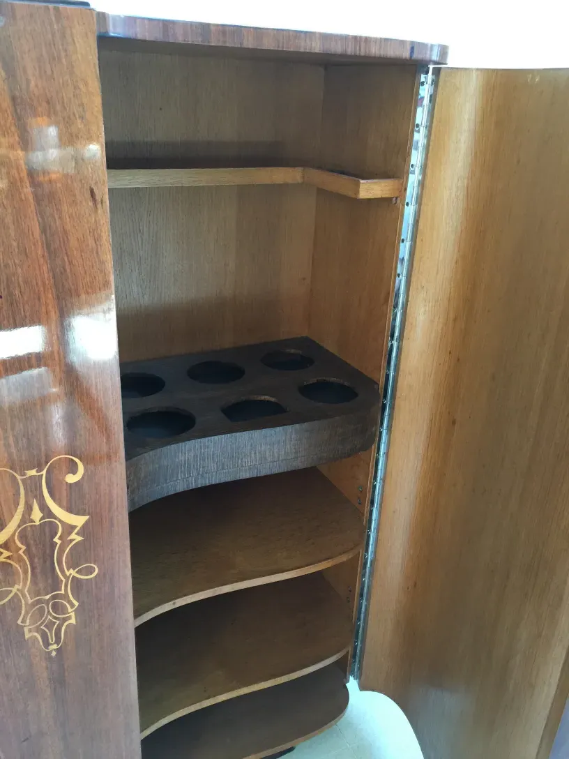 antique bookcase with compartments for books and items