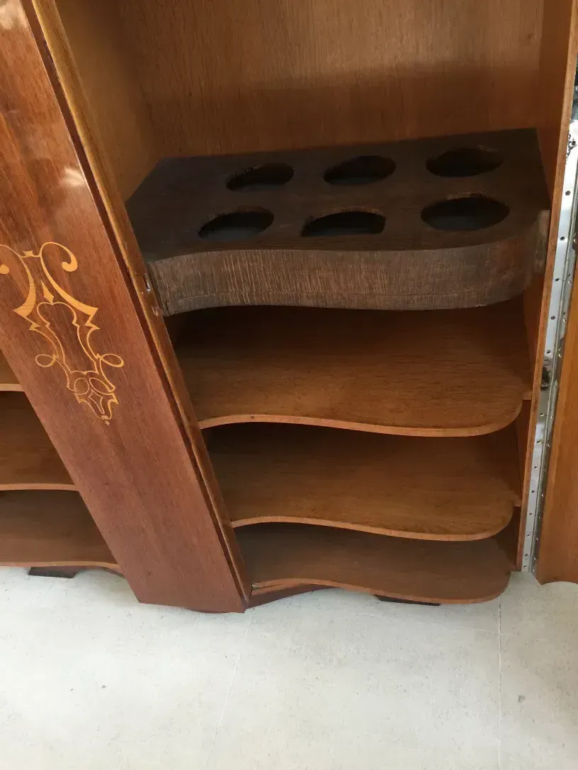 antique bookcase with curved shelves and elegant design