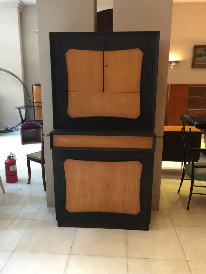 Antique bar cabinet with a sleek wood design and classic atmosphere.
