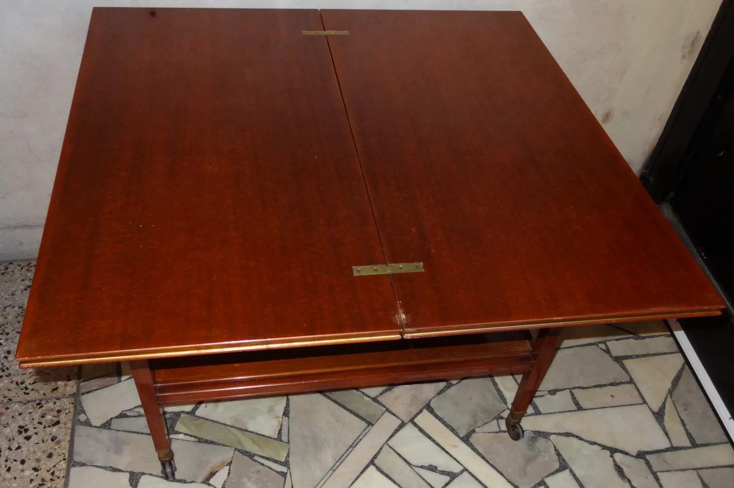 antique comte table, perfect for four people, in a cozy setting.