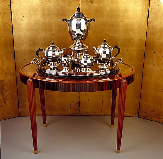 antique small table with a tray and teapots