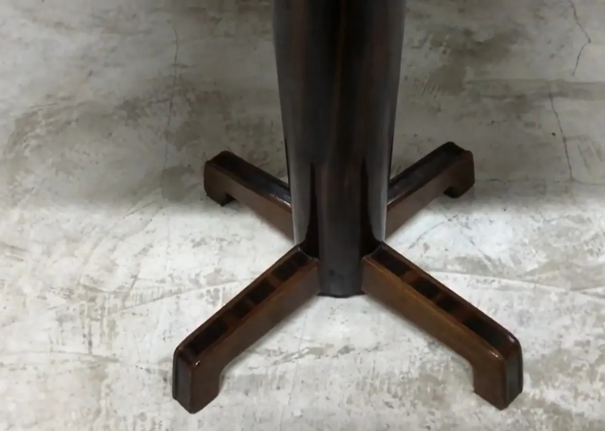 antique table in art deco style with distinct base