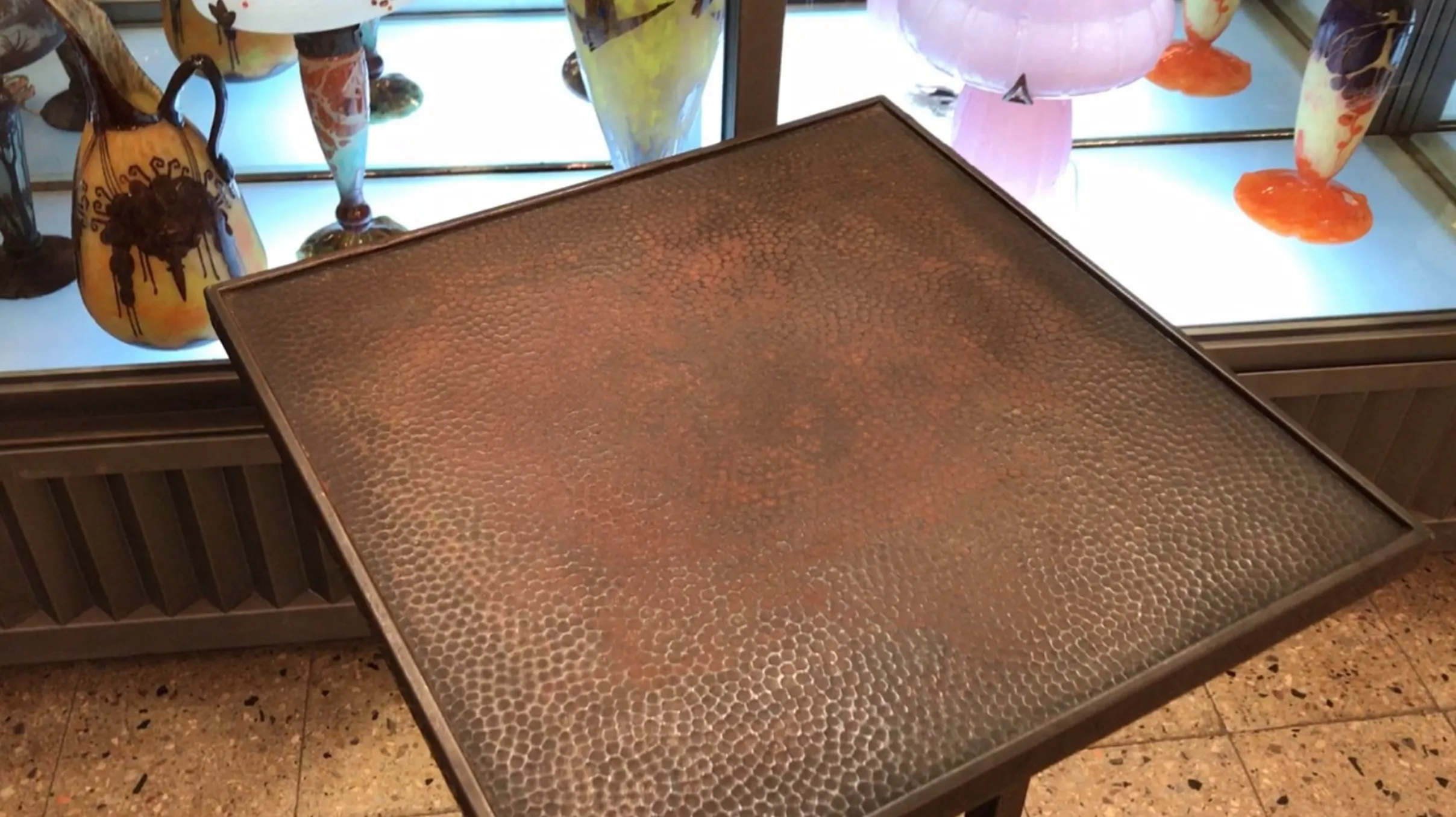 antique small table with decorative surface design