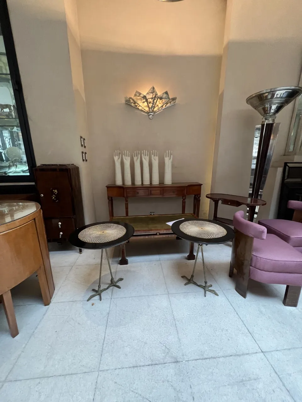 2 small antique tables with hand decorations in an elegant setting