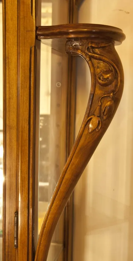 Decorative details on the antique display cabinet by louis majorelle