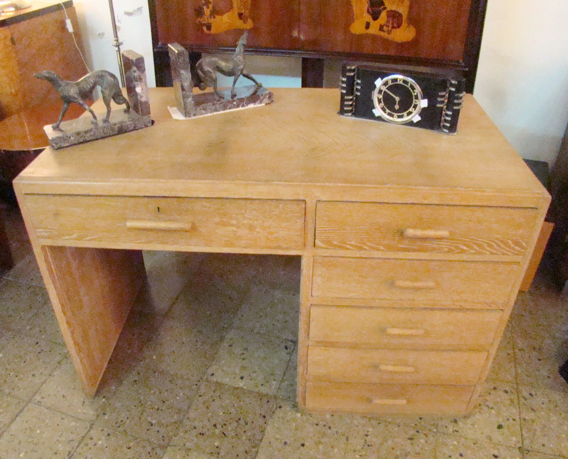antique desk displayed with animal decorations and clock