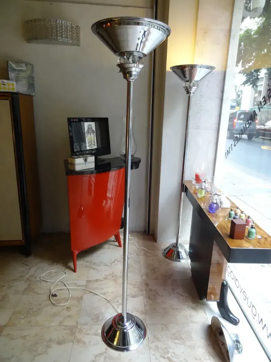 Set of 2 antique art deco floor lamps in a cozy environment with modern decor.