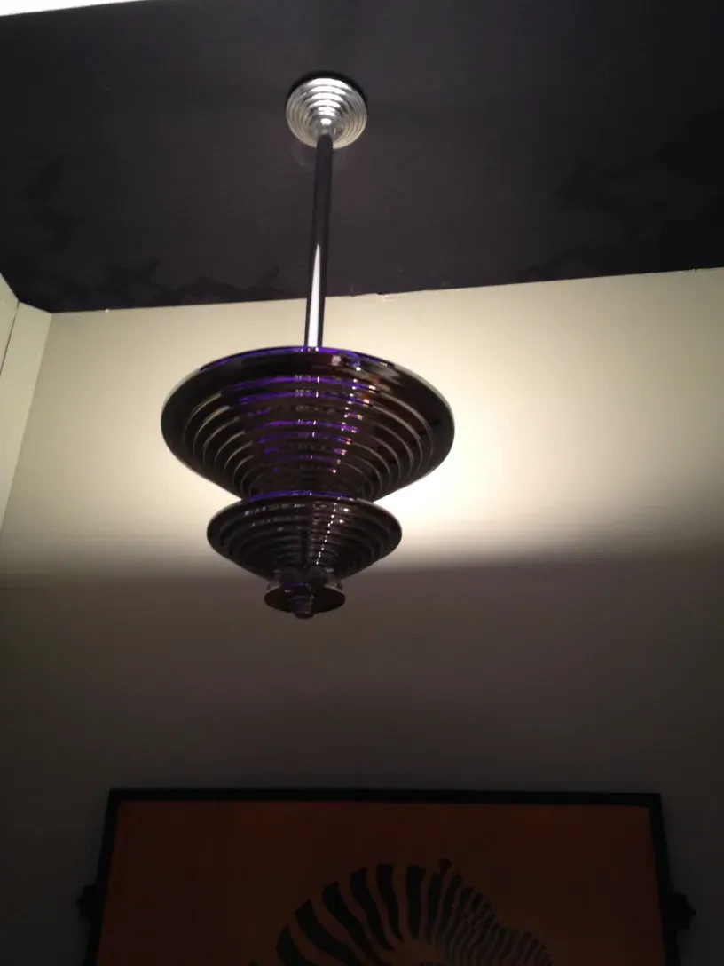 Antique hanging lamp with sculpted shapes and soft light