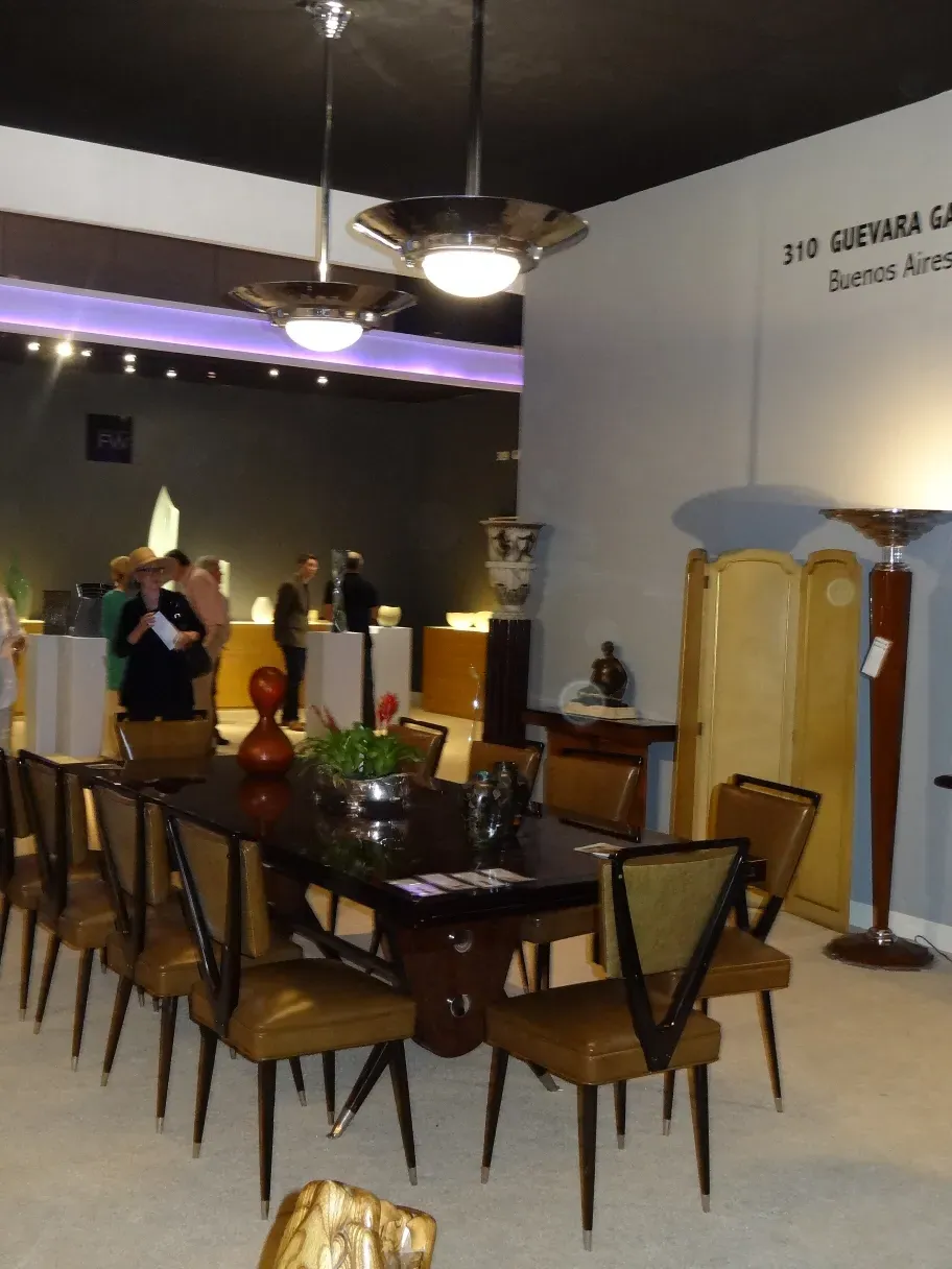 Four vintage hanging lamps in art deco style, illuminating an elegant space.