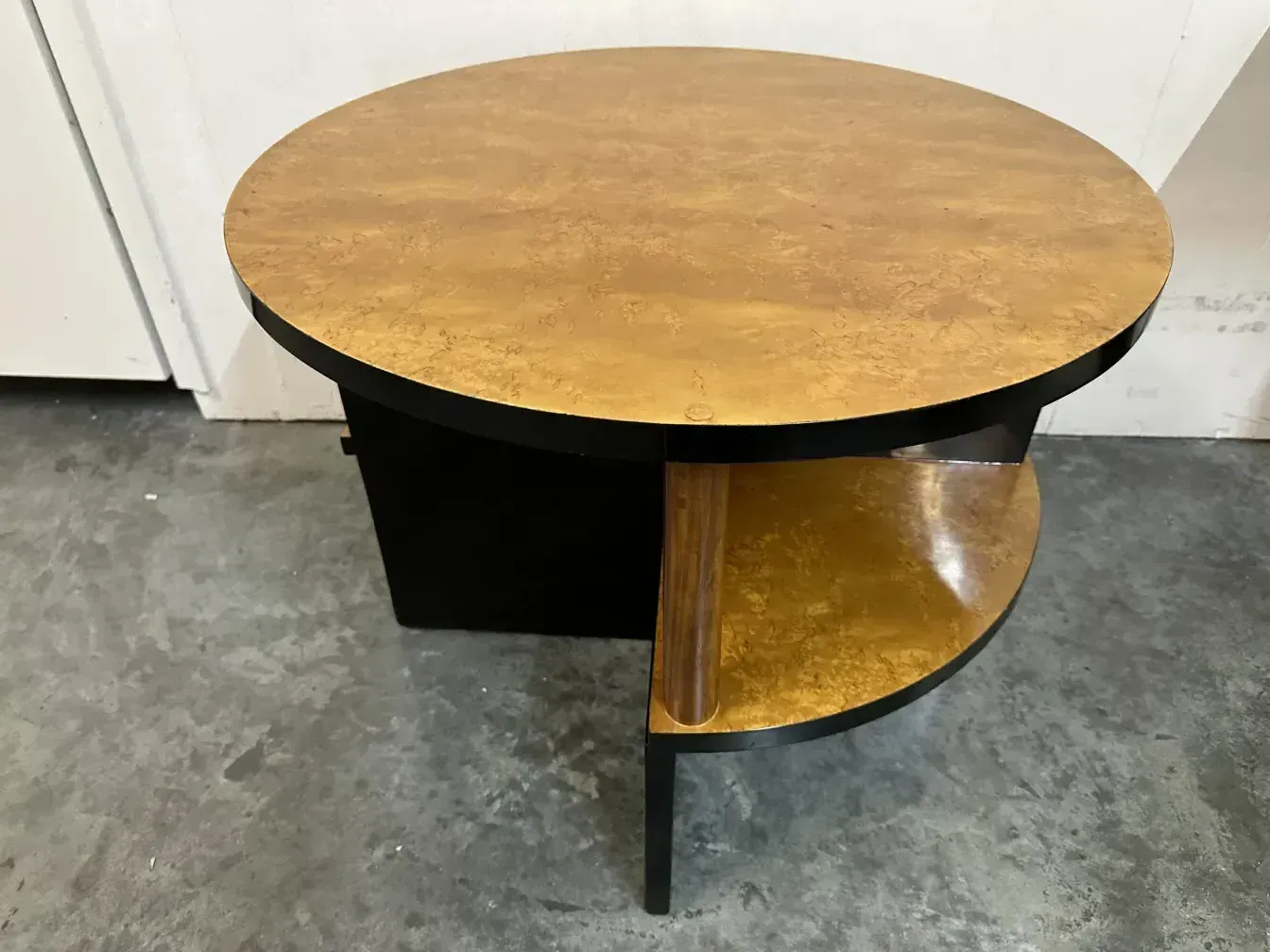 View of 2 antique small tables with round shape and golden colors