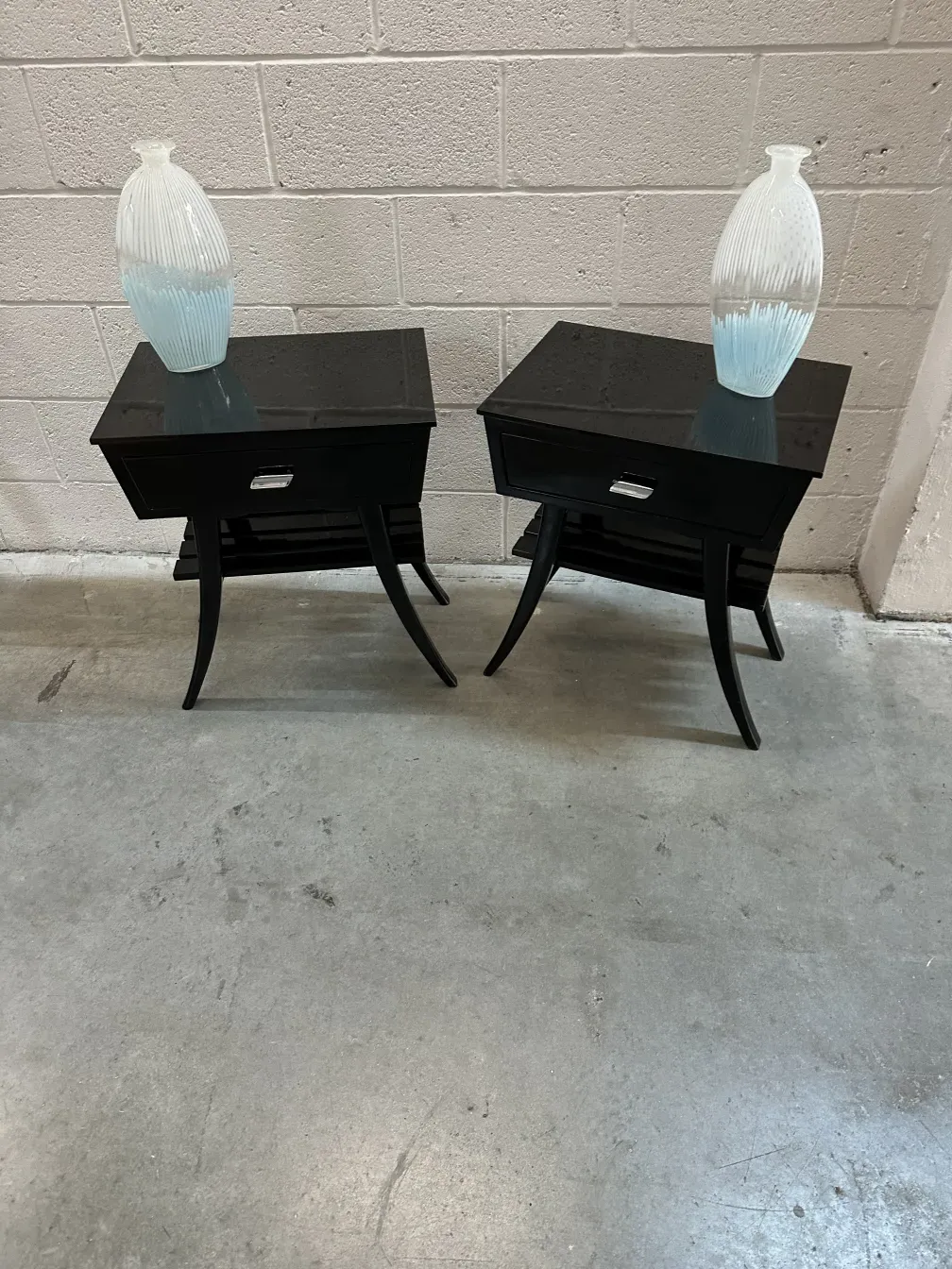 Two antique murano vases, decorative, on black table
