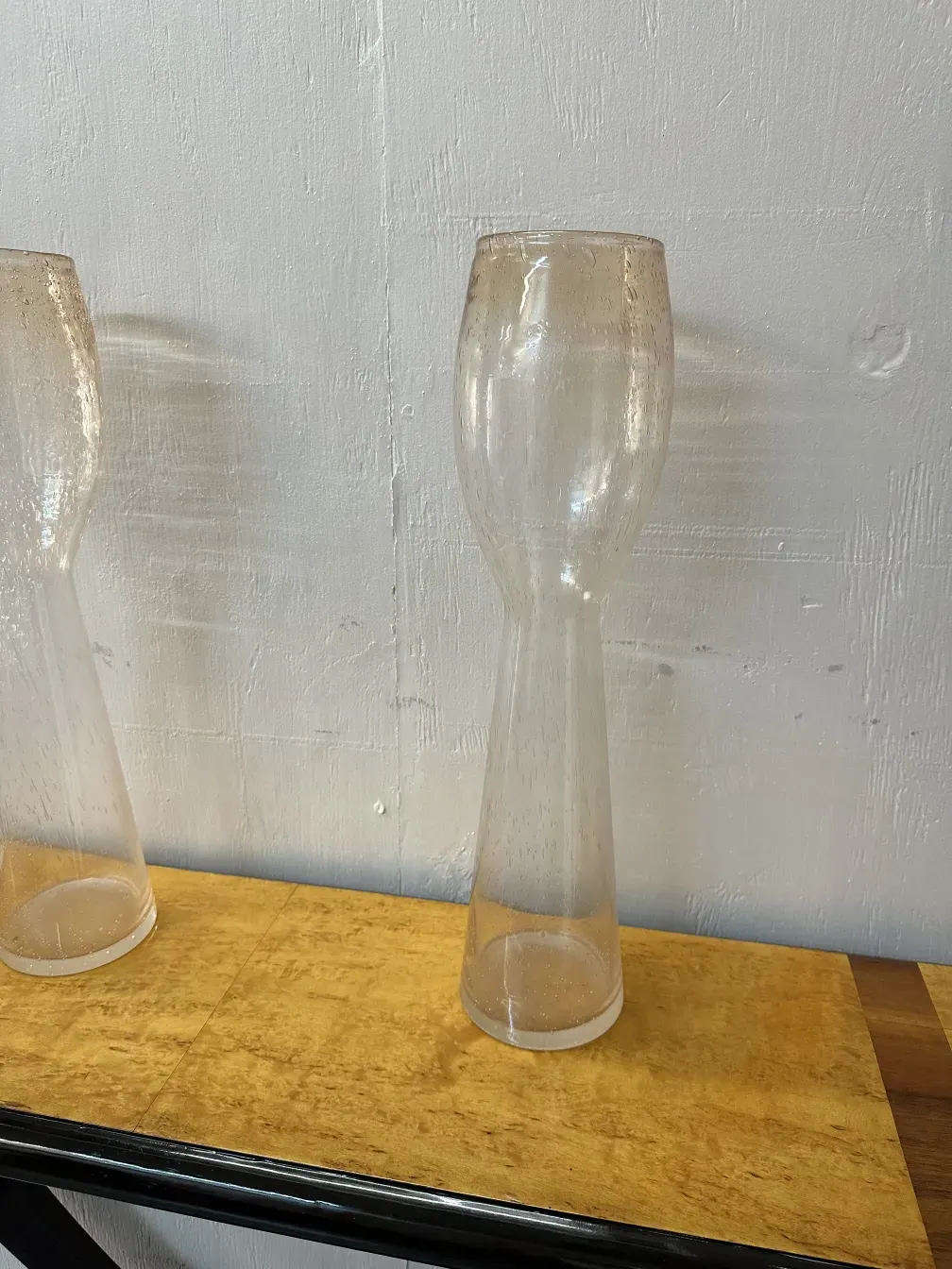 Elegant antique murano vases with decorative shapes.