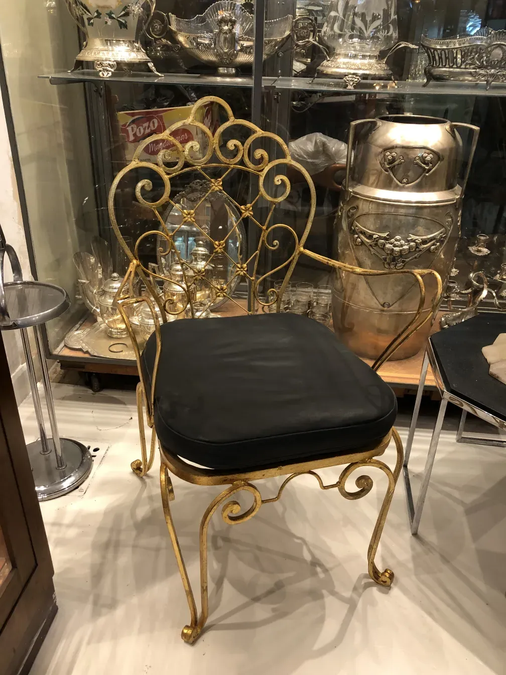 antique garden armchairs with elegant curved design in an antique setting