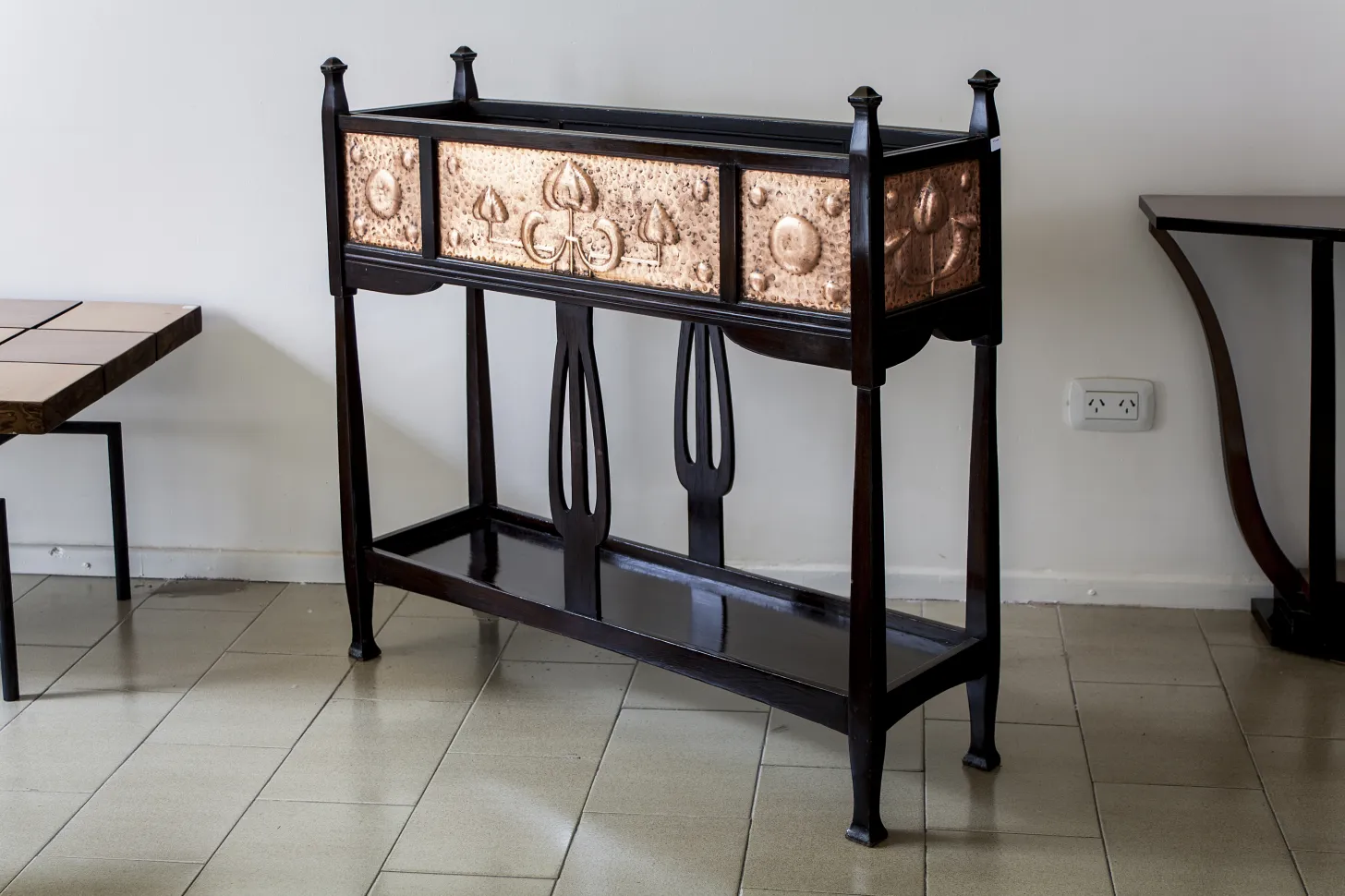 antique console with decorative relief and elegant legs