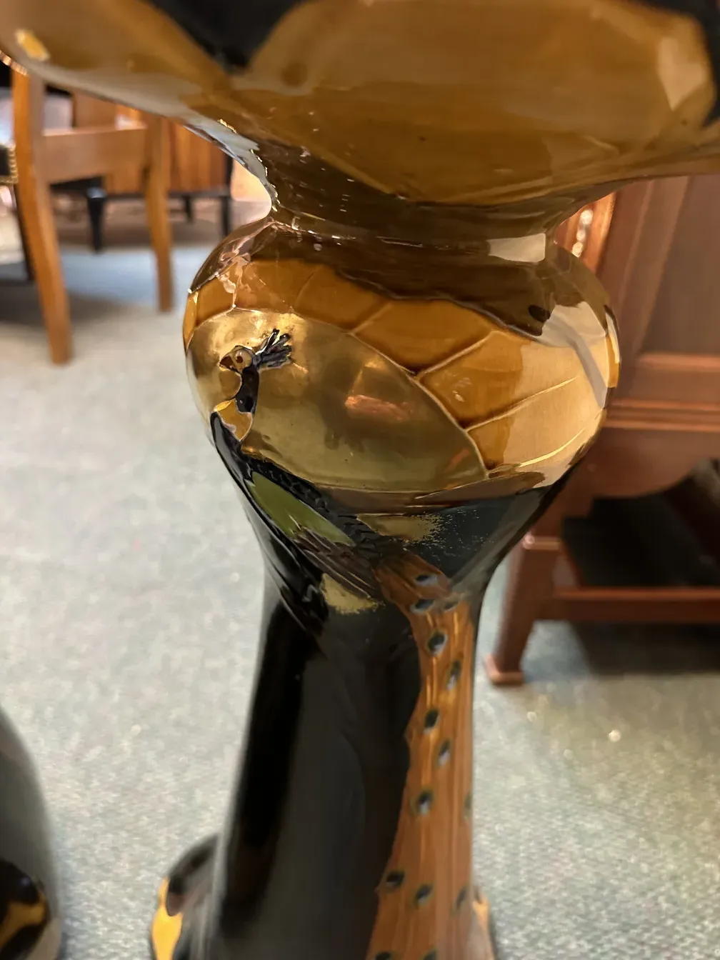 antique planter with decorative black and gold design