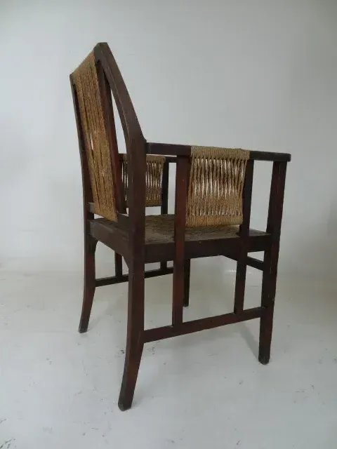 Antique desk chair by Edward Wormley with natural design back and arm