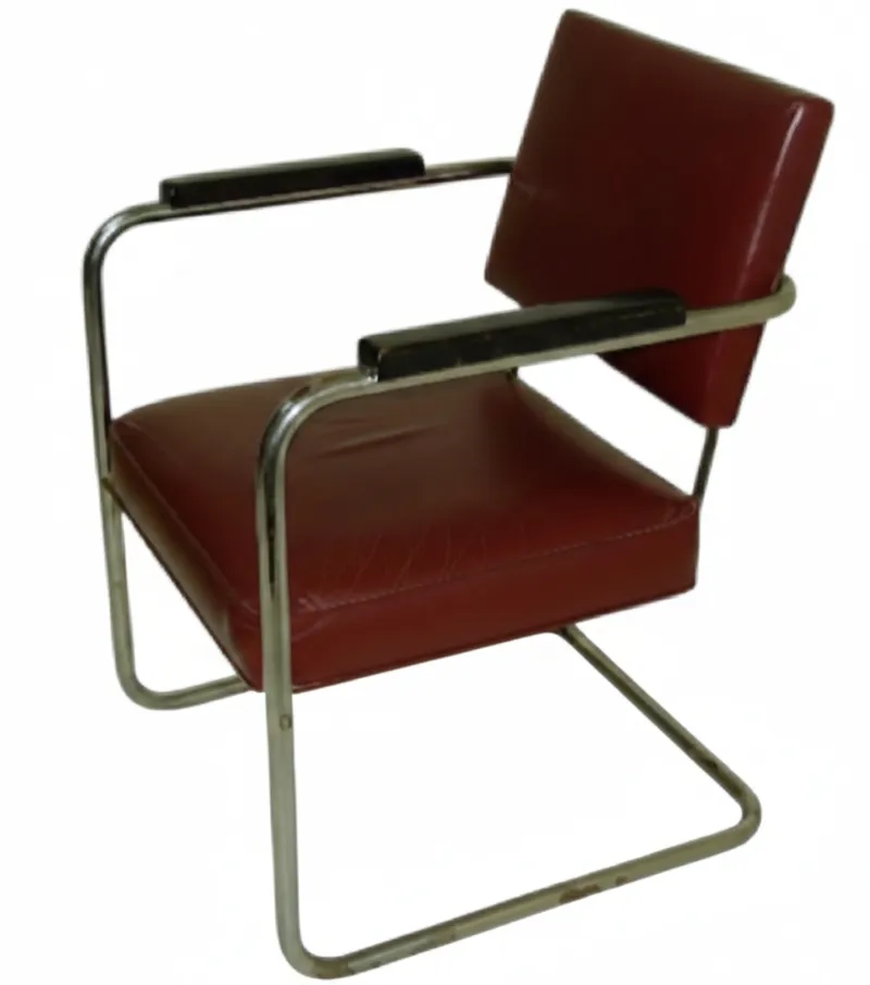 two antique armchairs with classic design, one in shades of red, in a restoration environment.