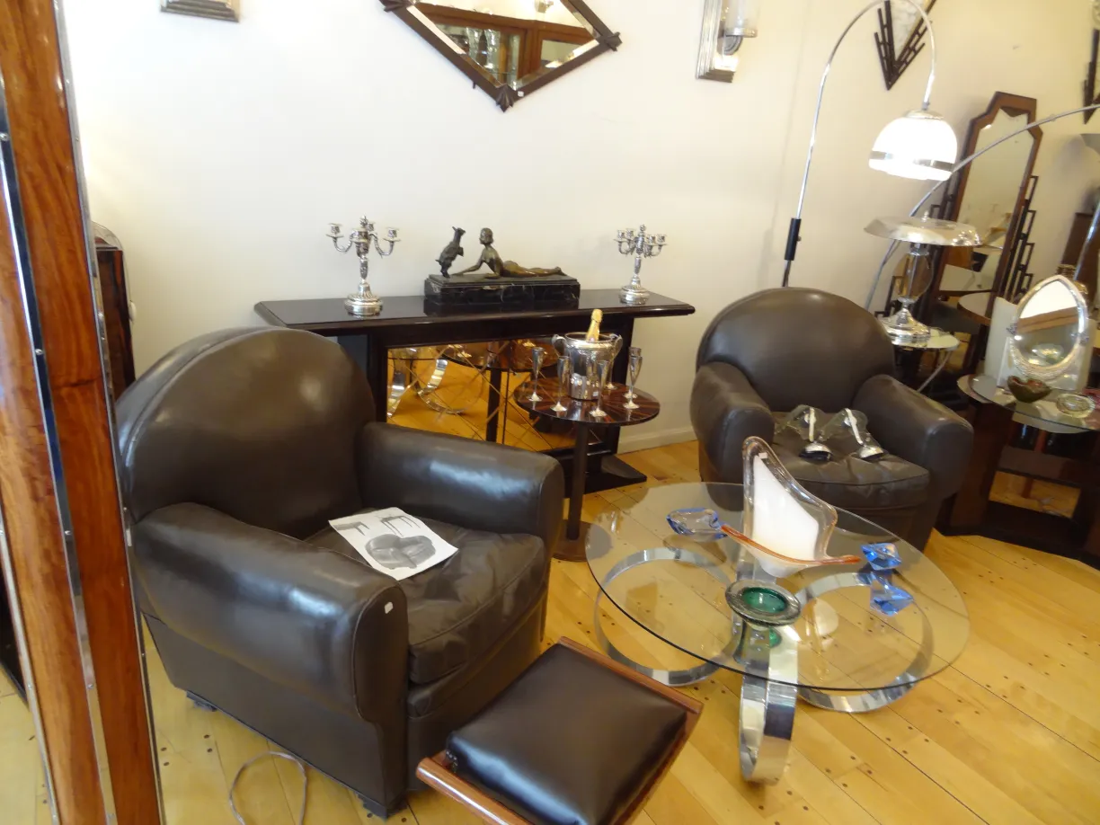 Two antique armchairs in an elegant setting, ready for restoration.
