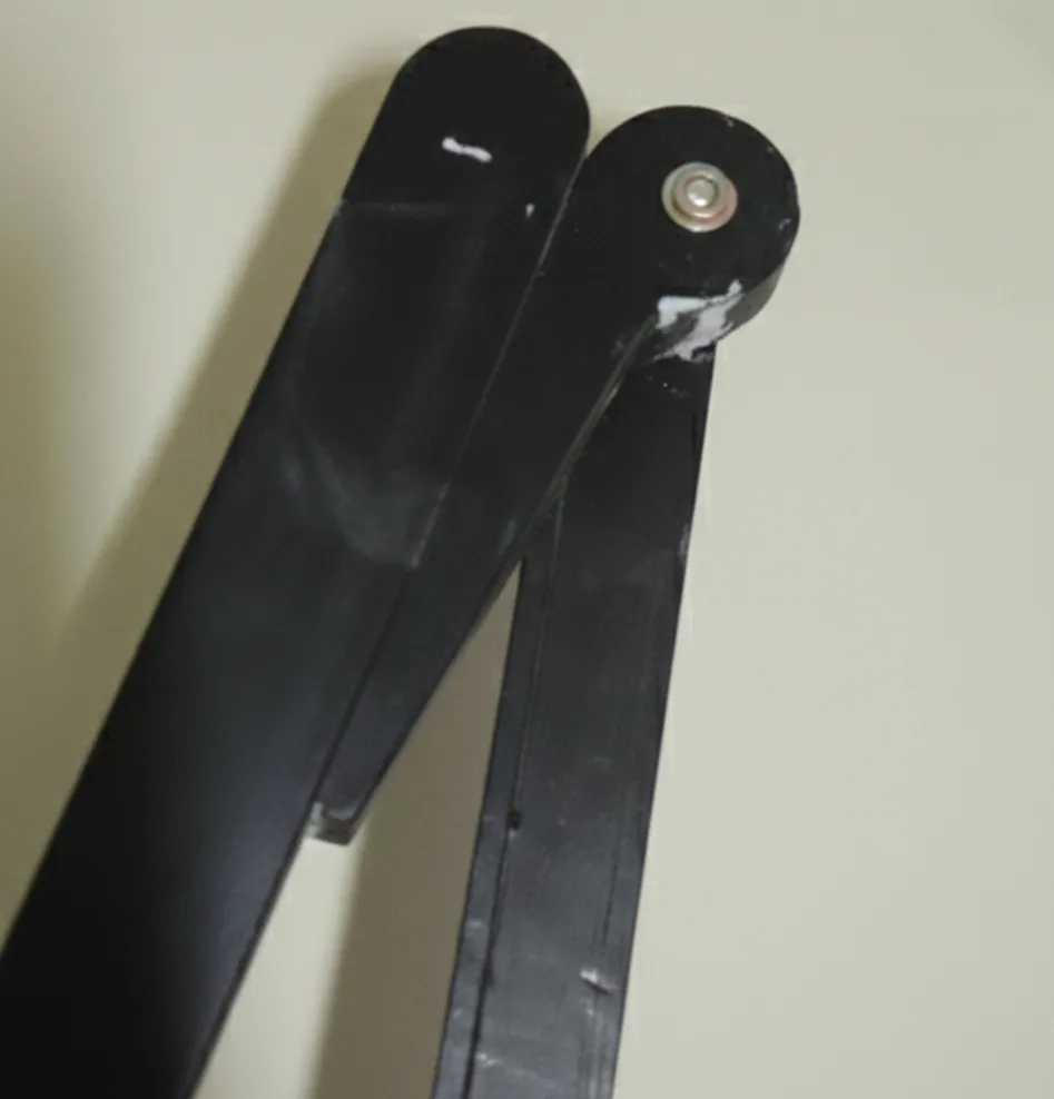 Side views of two antique armchairs ready to be restored, in good condition.