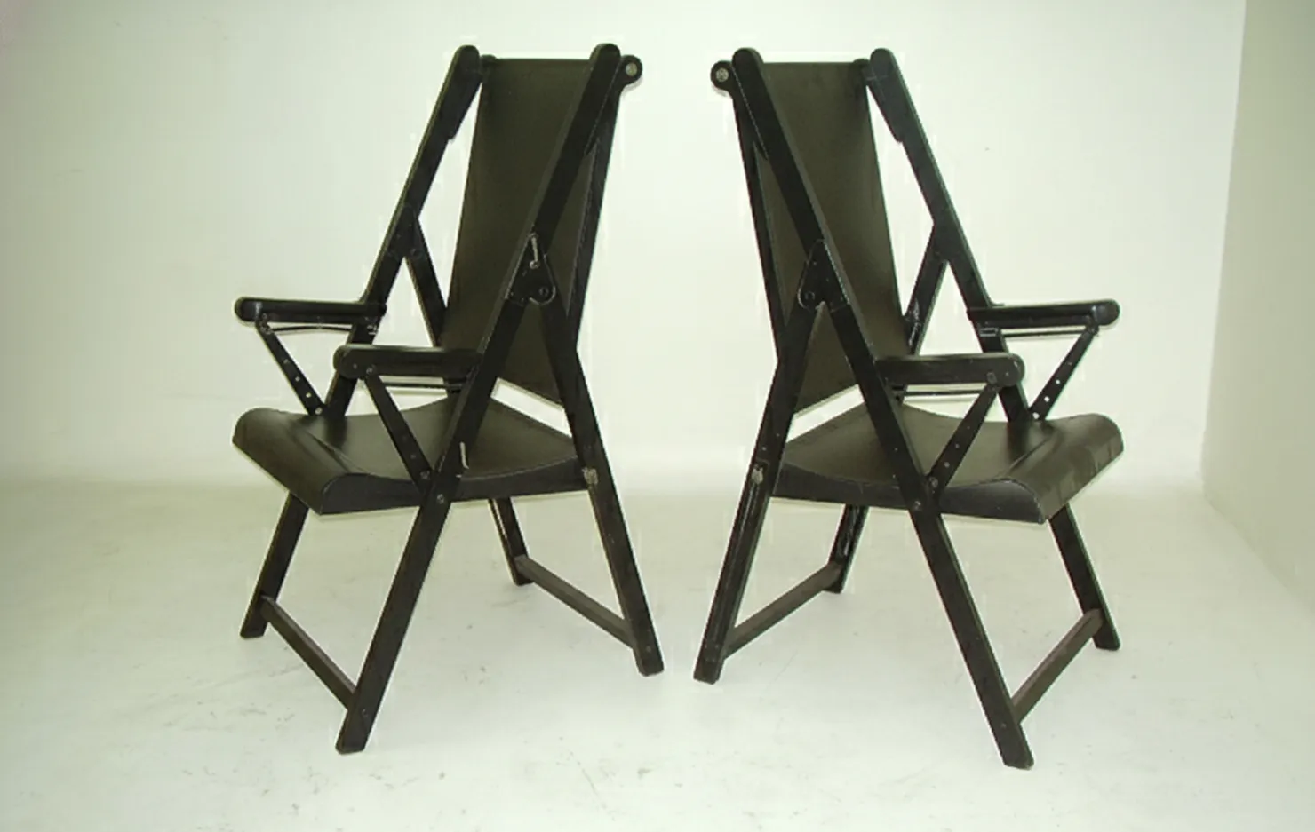 two antique armchairs with black frame on white background