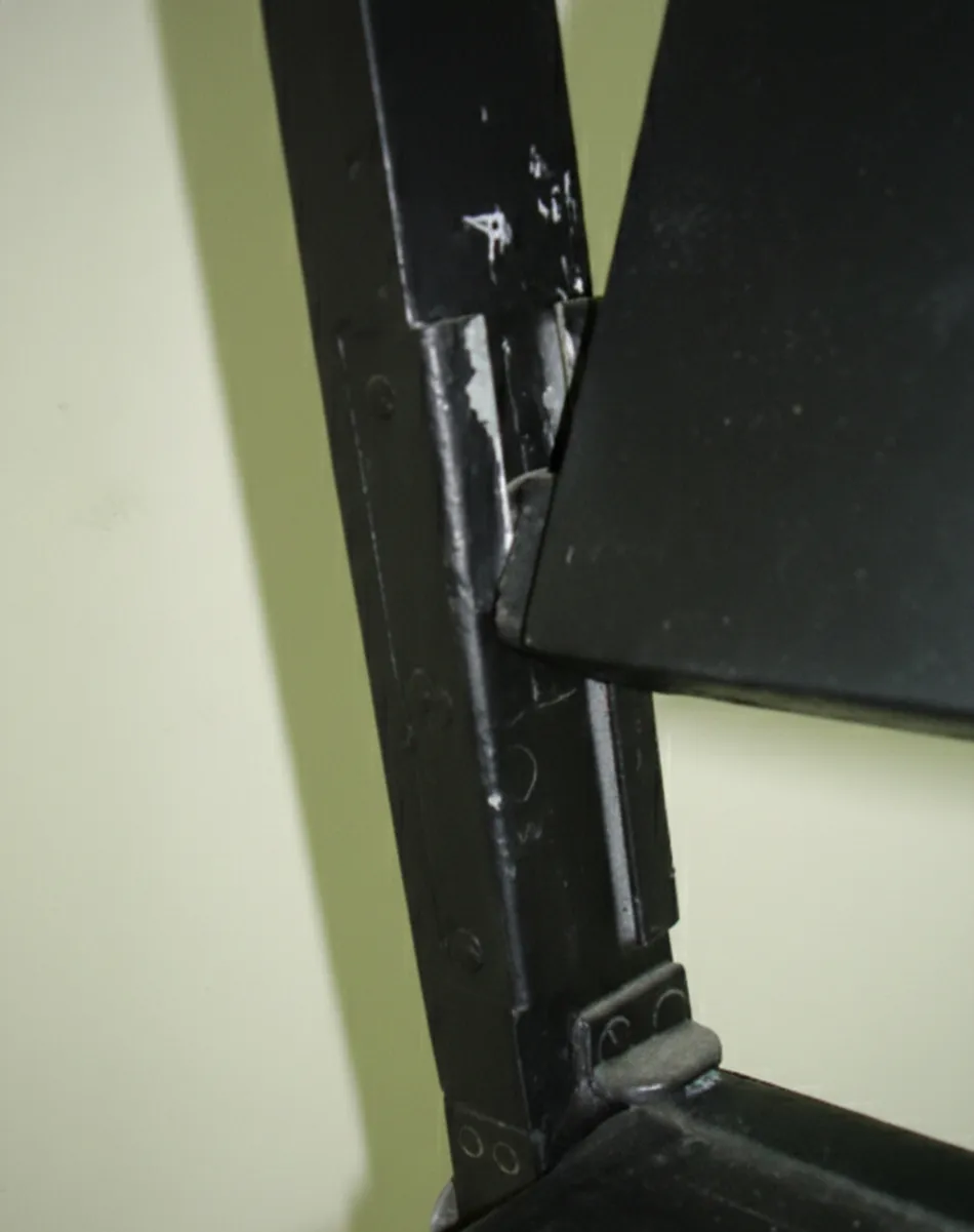 View of the two antique armchairs needing restoration, in a neutral environment.