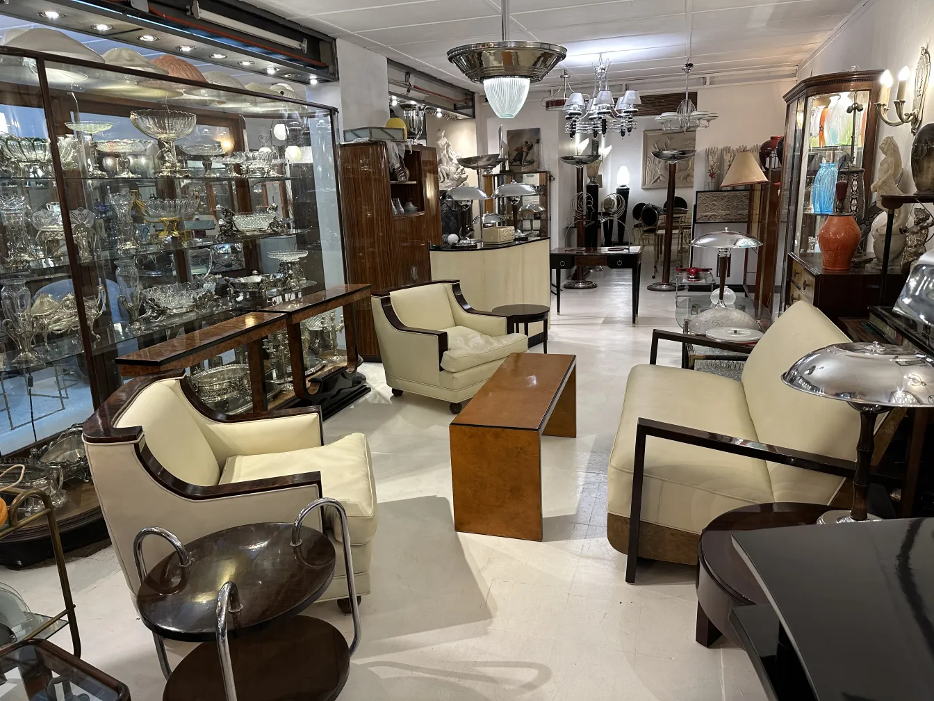 Antique coffee table in a room filled with elegant decorations and antiques