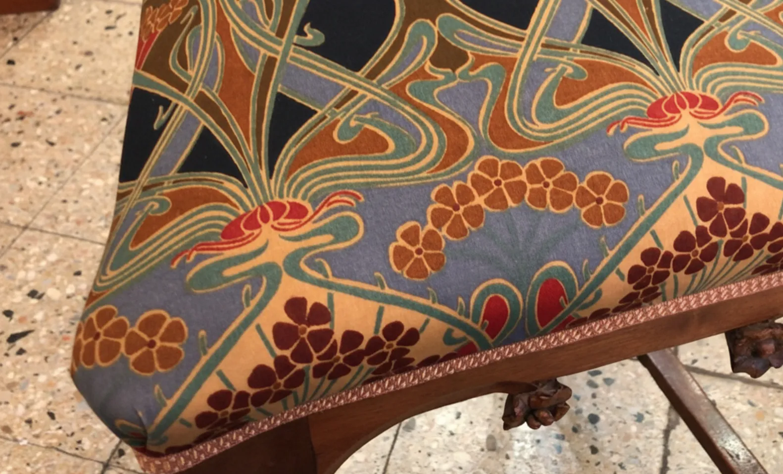 Antique chair with floral upholstery, decorative setting