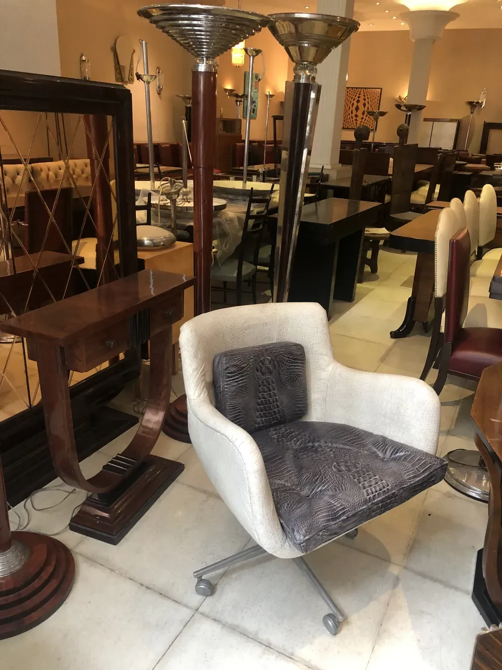 Antique armchair in a setting with other furniture pieces.