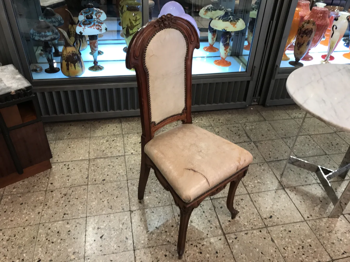 antique chair to restore, with worn upholstery, antique ambiance