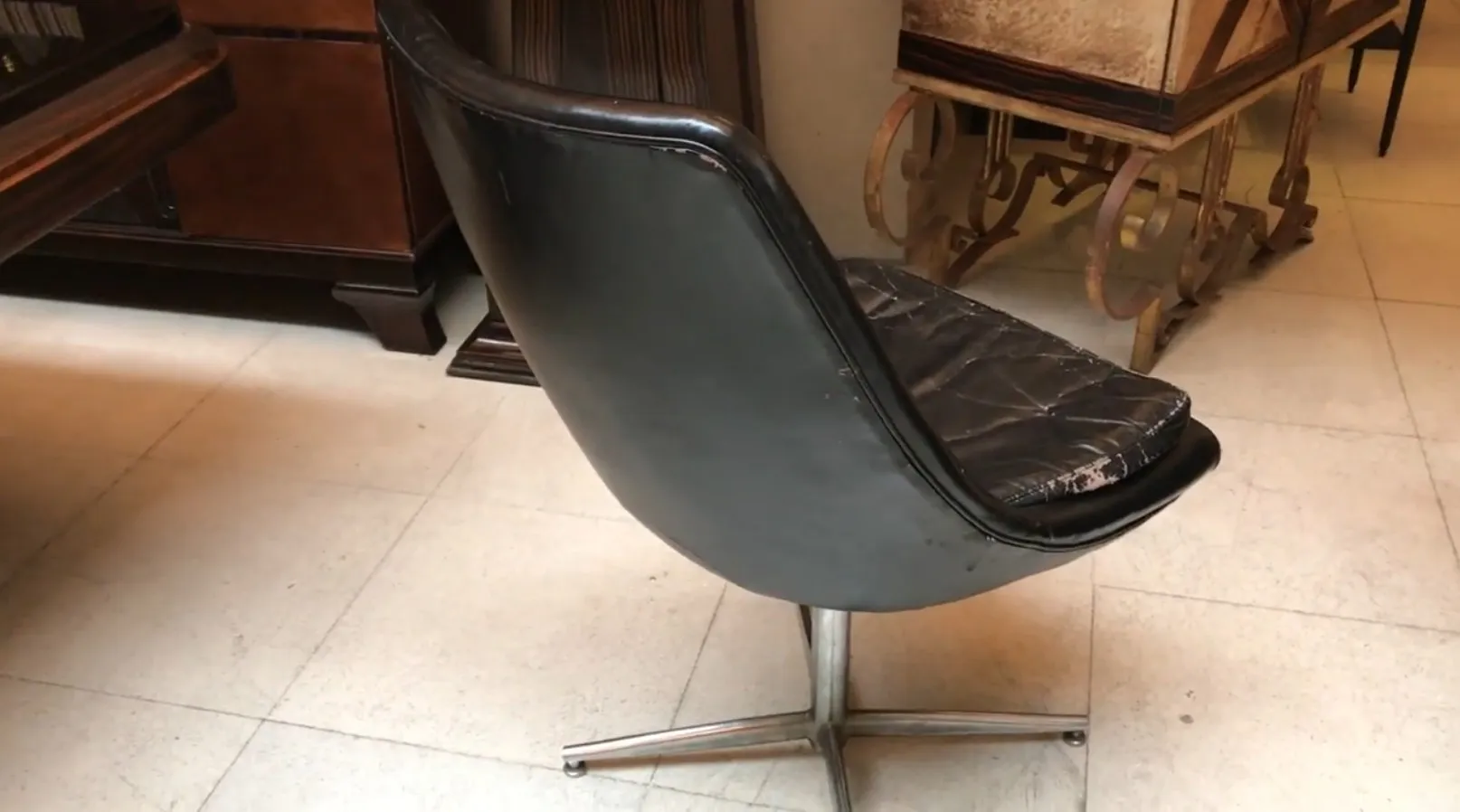 2 antique desk chairs with curved design in antique setting