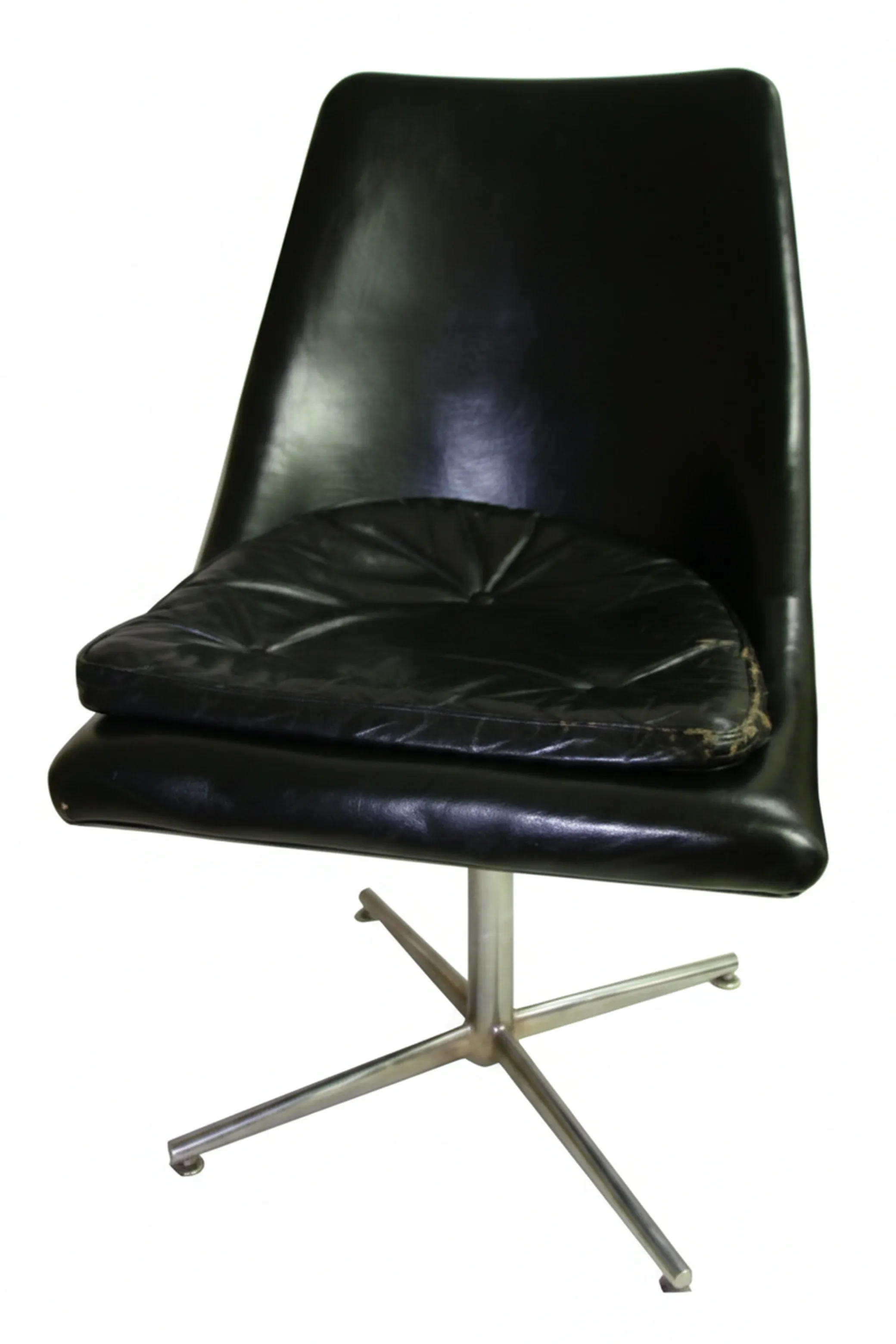 Antique desk chairs with modern design, visible wear on cushions, minimalist environment.