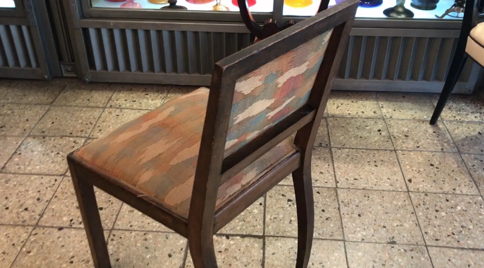 Antique chair with decorated backrest, ideal for restoration in Art Deco style.