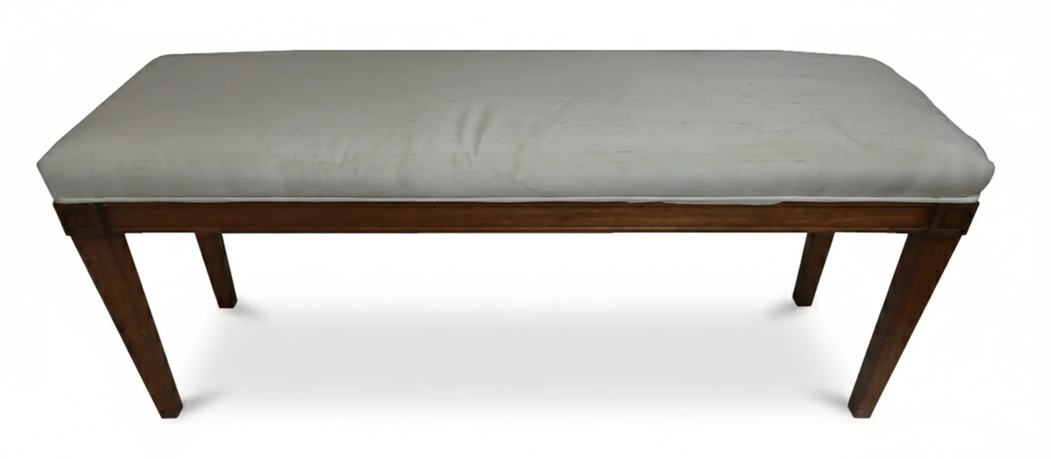 Sgabello antico decorativo con cuscino chiaro, stile classico.