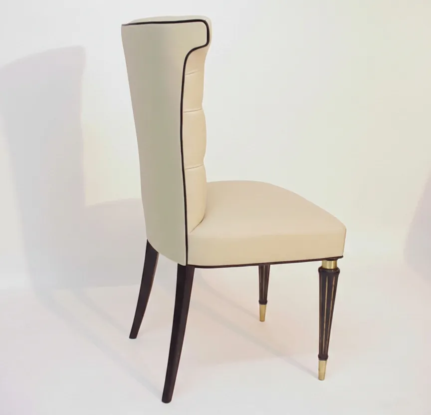 Side view of 6 antique chairs, upholstered in light color with elegant legs.