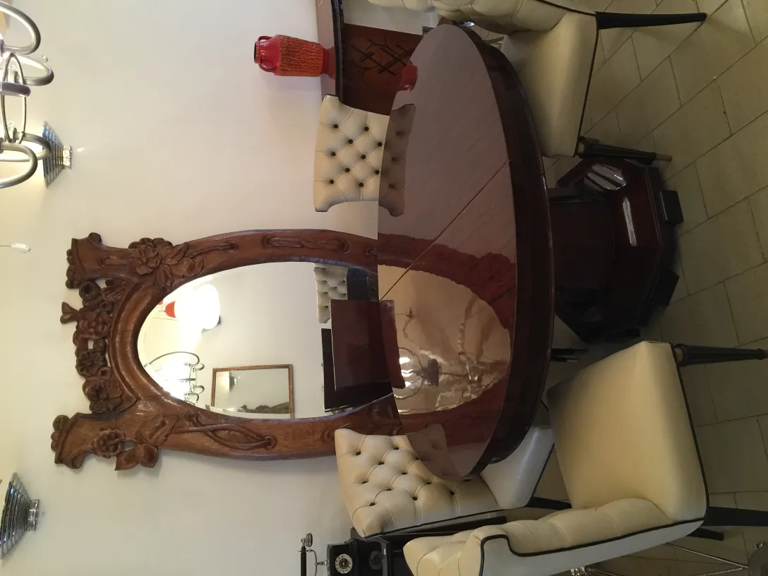 Six antique chairs in an elegant dining area with luxurious decor