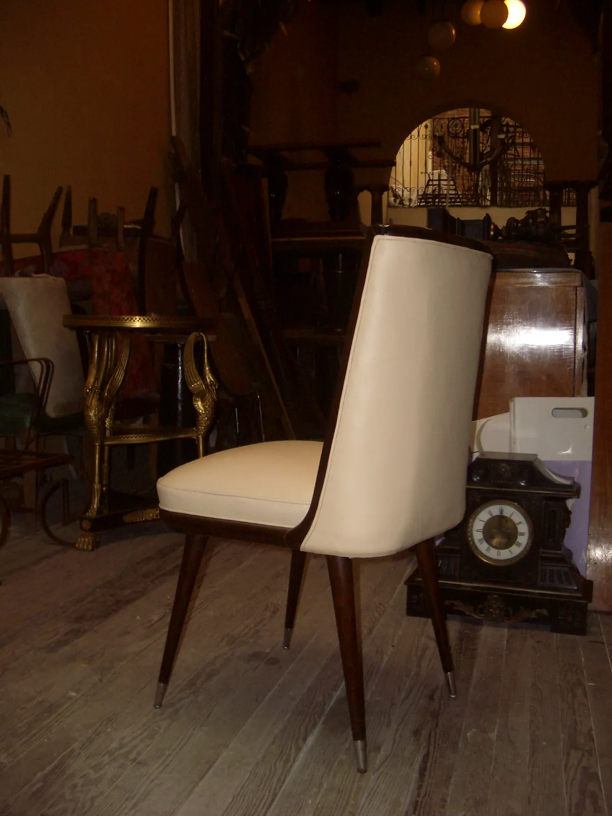 6 antique chairs in a vintage setting