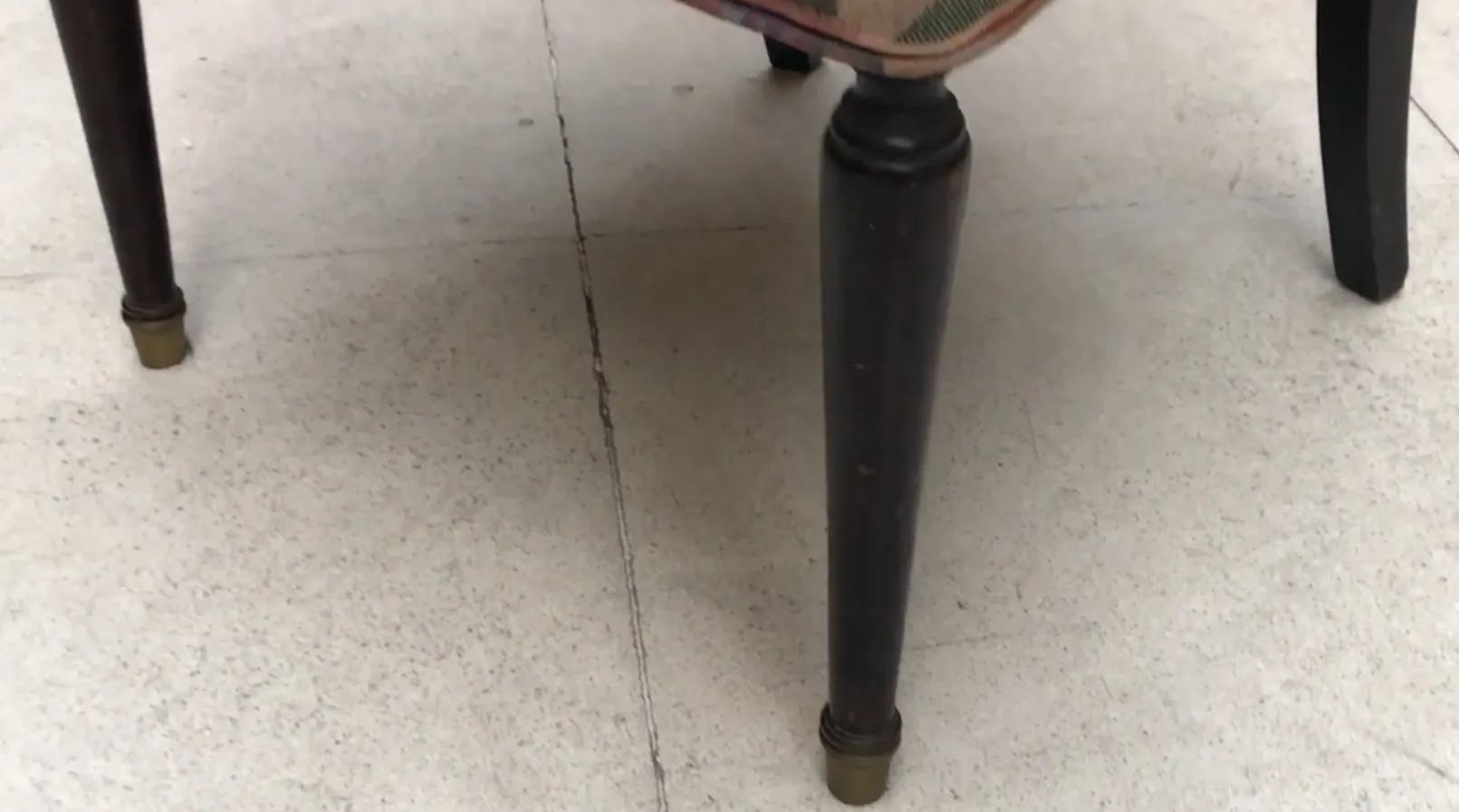 8 antique chairs to restore, black legs, simple setting.