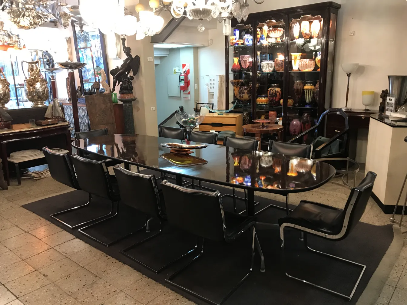 A set of 10 antique chairs in an antique shop setting.