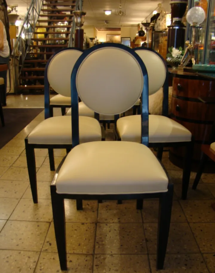 12 antique Art Deco chairs ready for restoration.
