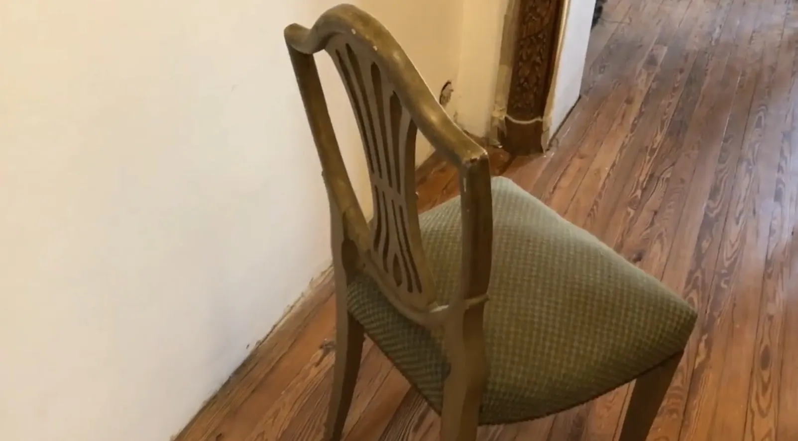Side view of 10 antique chairs to restore in a cozy setting.
