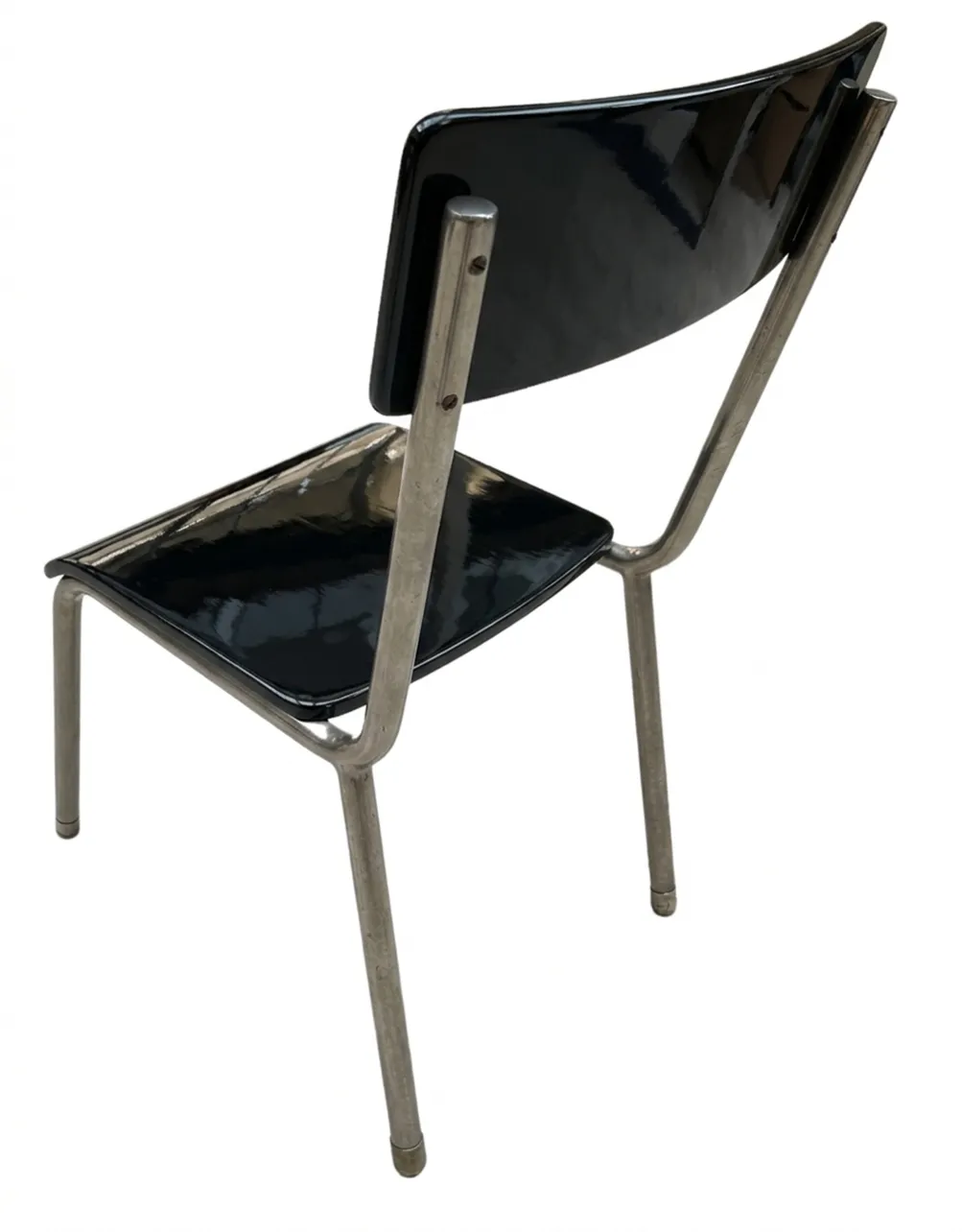 4脚のアンティークバウハウス椅子の背面ビュー、光沢のある黒色。