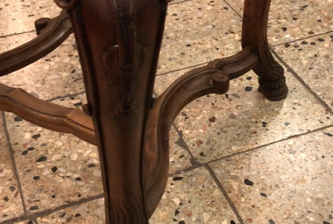 two antique chairs with decorative details in a simple environment.