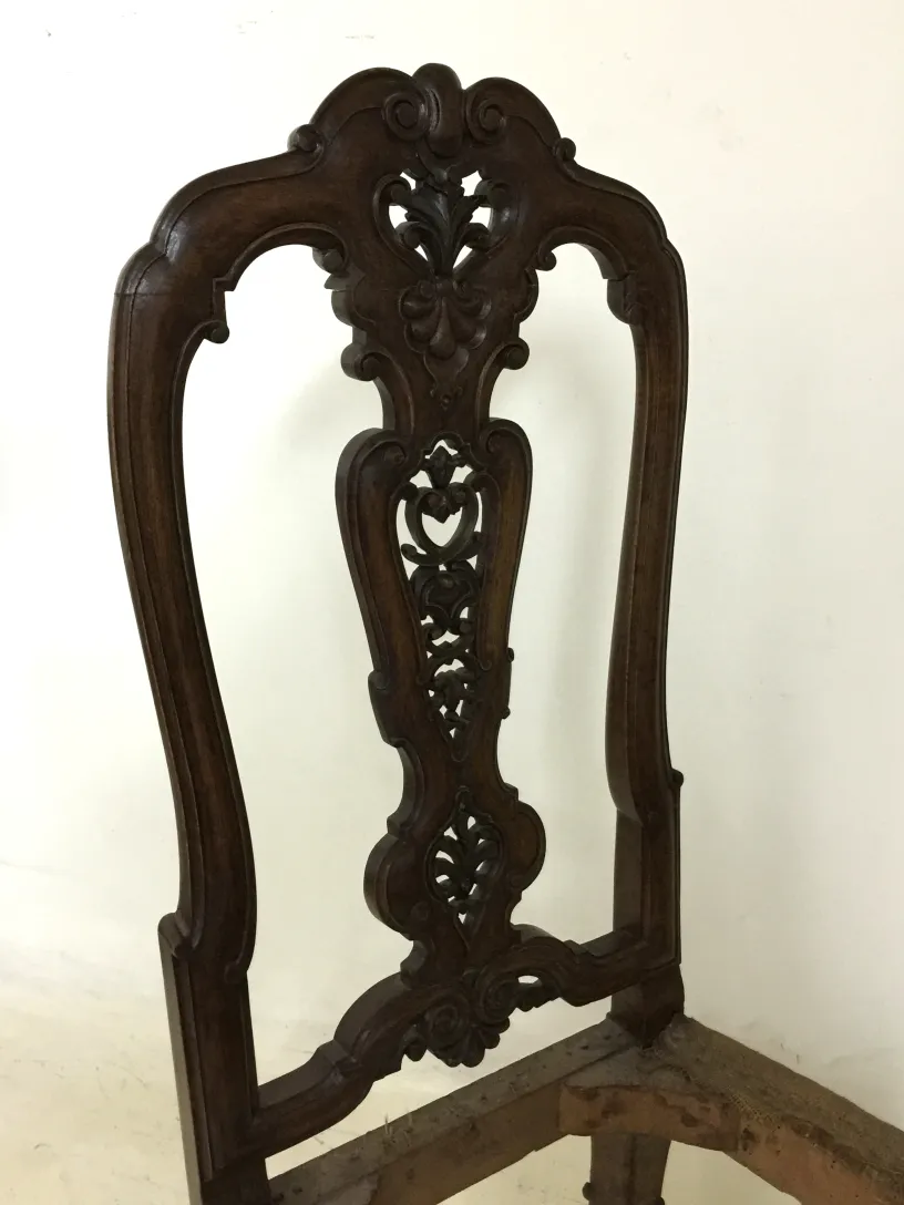 two antique chairs with intricate design and ornamental details, perfect for restoration