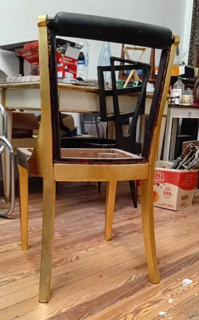 View of 6 antique chairs with art deco details in a restoration setting