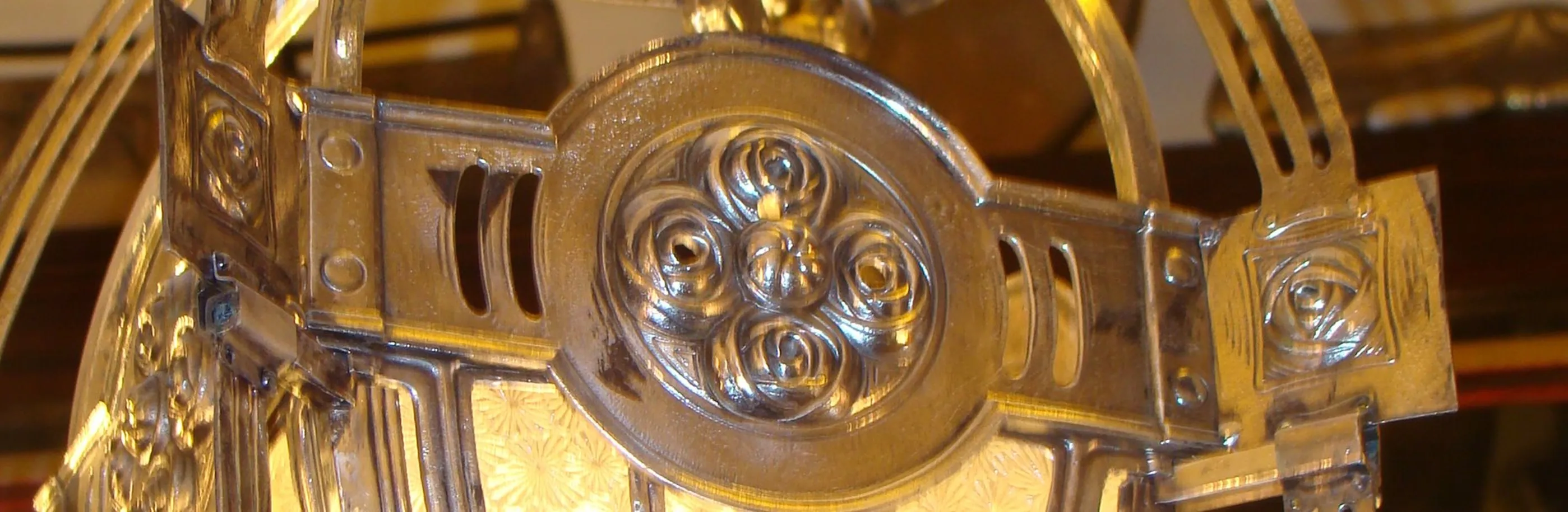 Antique hanging lamp with decorative details by Mackintosh.