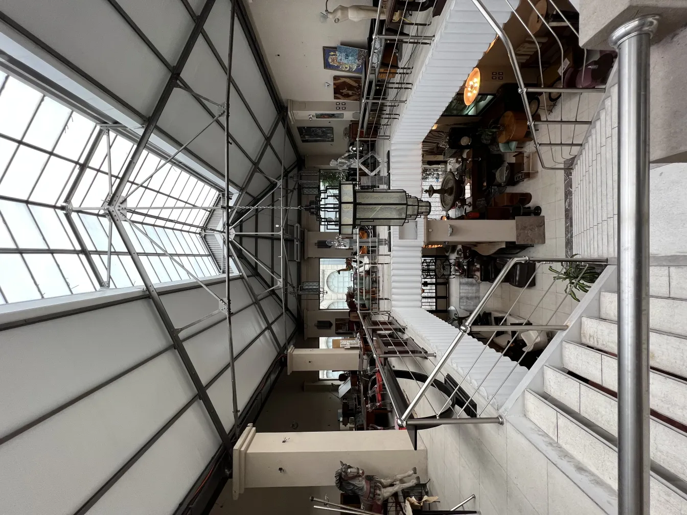 Antique lantern with light hanging in an artistic space.